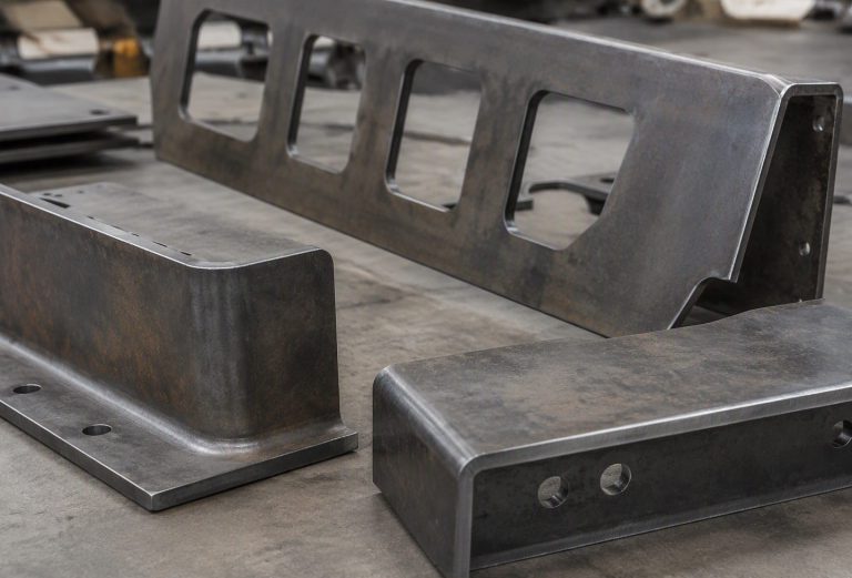 Heavy mild steel machine guard panels and structural gussets with sheared edges